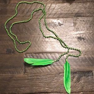 Long beaded feathers necklaces by Miami based designer Mare Sole Amore. Beaded